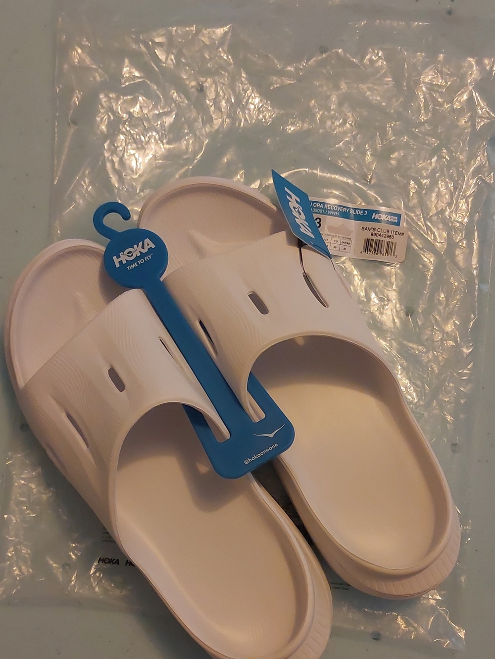 Hoka White Slip-On Recovery Slide with Blue Tag